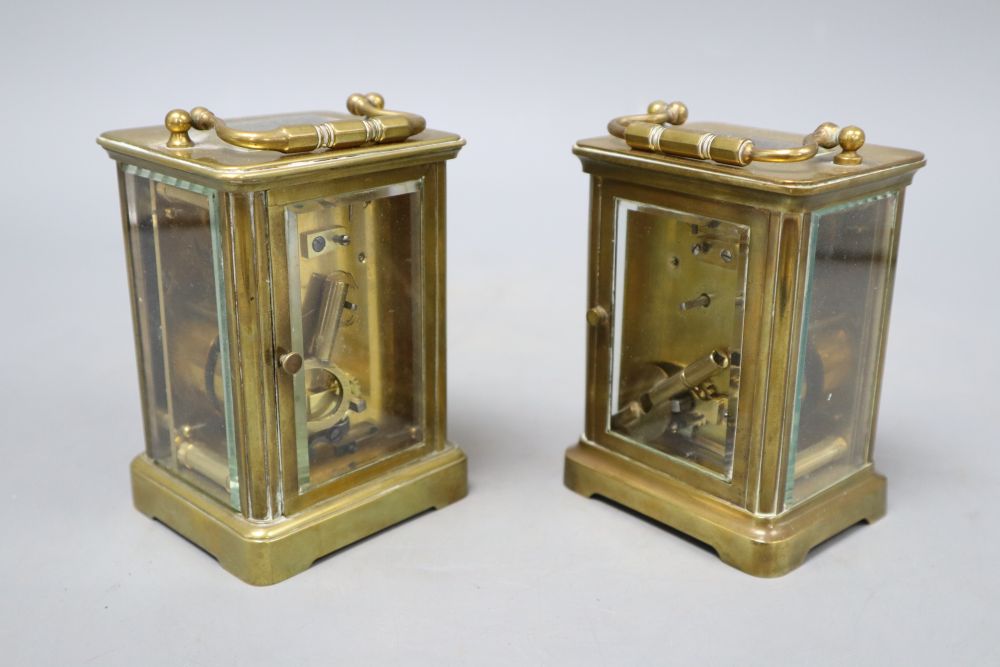 Two brass bound carriage timepieces, one with an enamelled dial, tallest 12cm with handle down